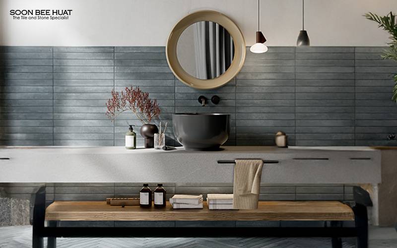 Modern bathroom with round mirror and vessel sink.