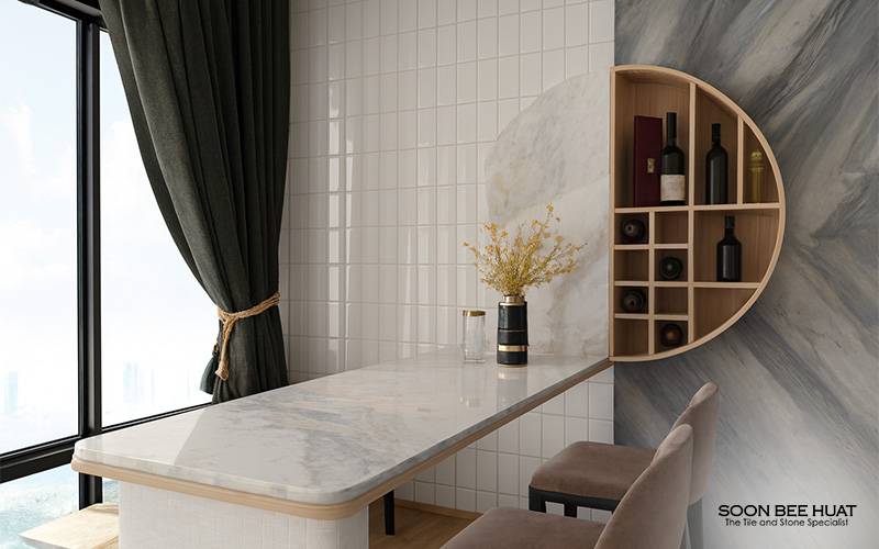 Elegant interior with marble-topped table, circular shelf of wine bottles, and city view through window.