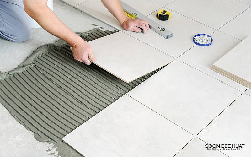layering tiles on floor
