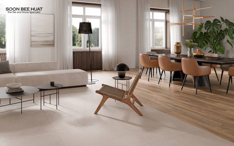 Open-concept living space with ivory tiles and wood-look flooring transition.